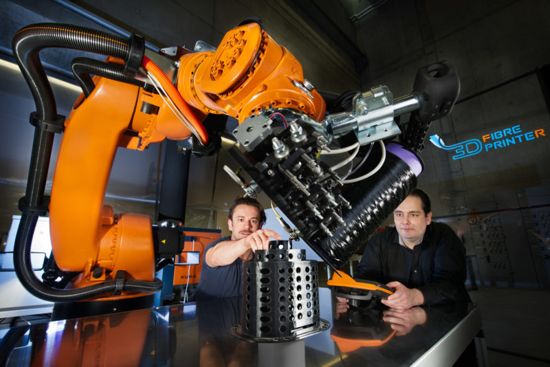 Technology photography: 3D fiber printer robot at the Fraunhofer Institute for Manufacturing Engineering and Automation IPA in Stuttgart-Vaihingen. Printing of a component made of carbon fiber for cable management in a robot.