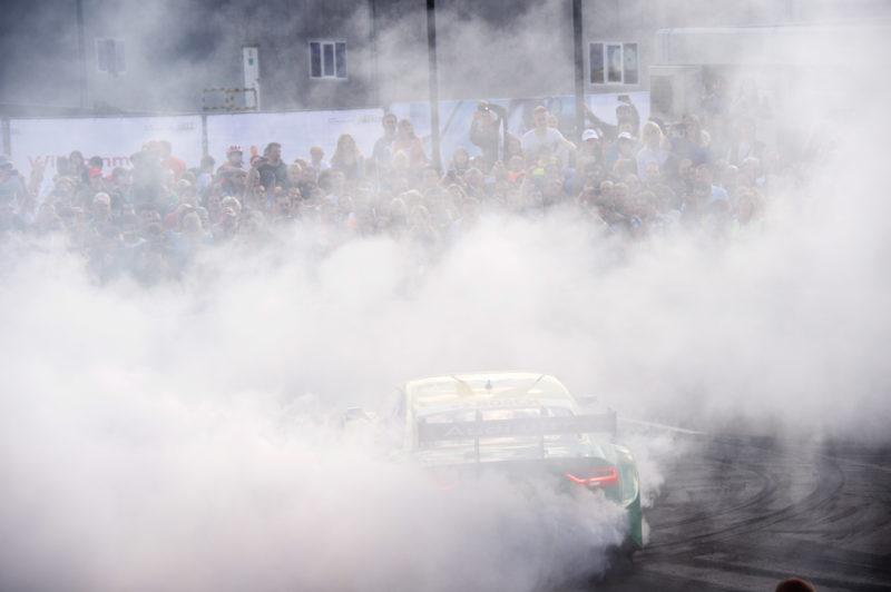 Editorial photography as event photography and fair photography: Event Photography: Traces of a demonstration of the Audi DTM team.