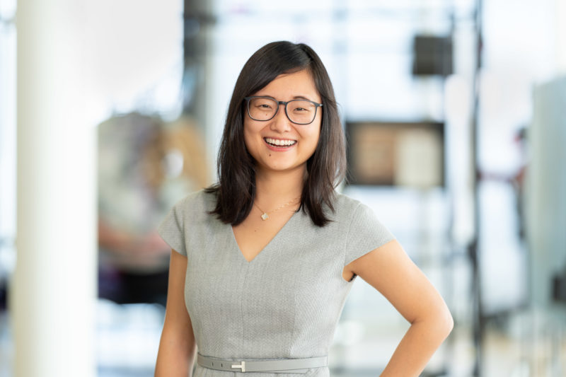 Business portrait: Employee portrait photographed in series. The background changes with every picture but yet appears as a series. Picture 11 of 35