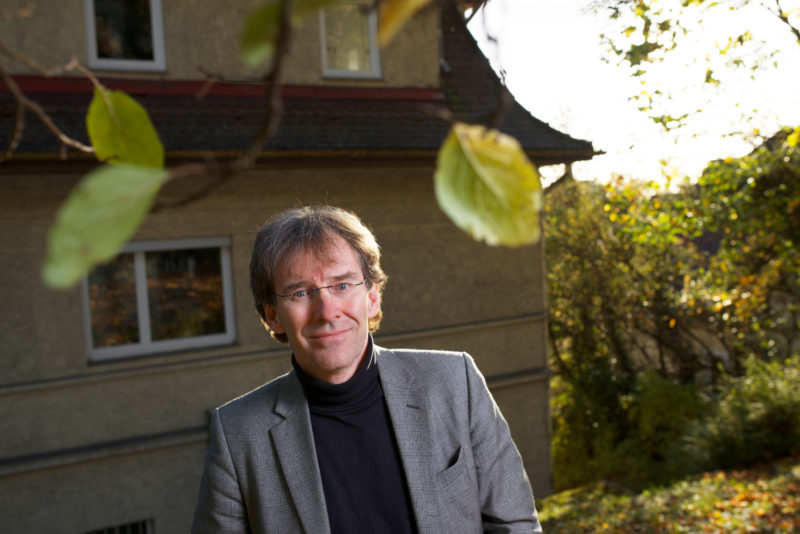 Event photography, editorial photography: Businessportrait: Prof. Dr. Urban Wirsing front of the building for Ethics and History of Medicine at the University of Tübingen.