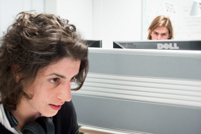 Science photography: Computer research at the Max Planck Institute for Intelligent Systems. The photo is photographed with a tilt lens so that the sharpness goes through the eyes of both people.