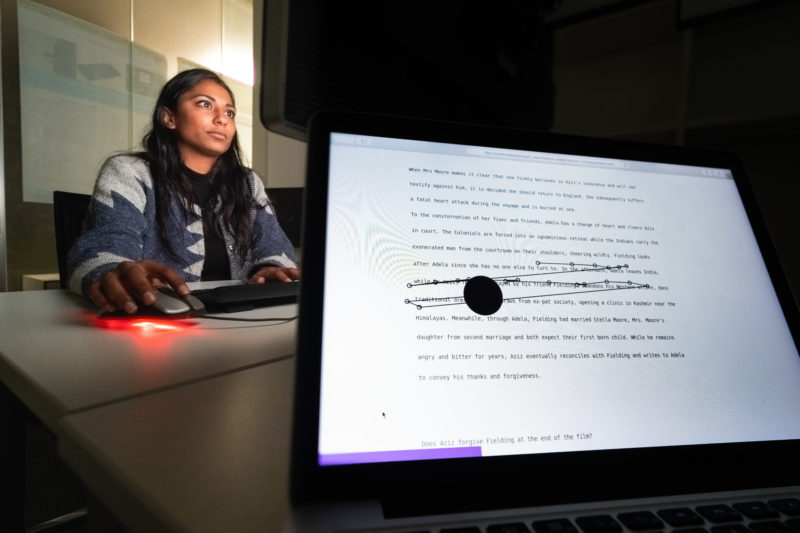 Editorial Photography: Scientist researches the interface between man and machine and the visual interaction required for this. In the foreground you can see the result of an ongoing experiment in the background. A test person reads a text and her eye movements are registered.