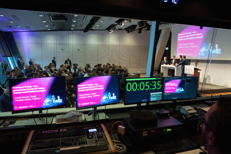 Event photography: A customer event of an IT company: A view from the control room into the event.