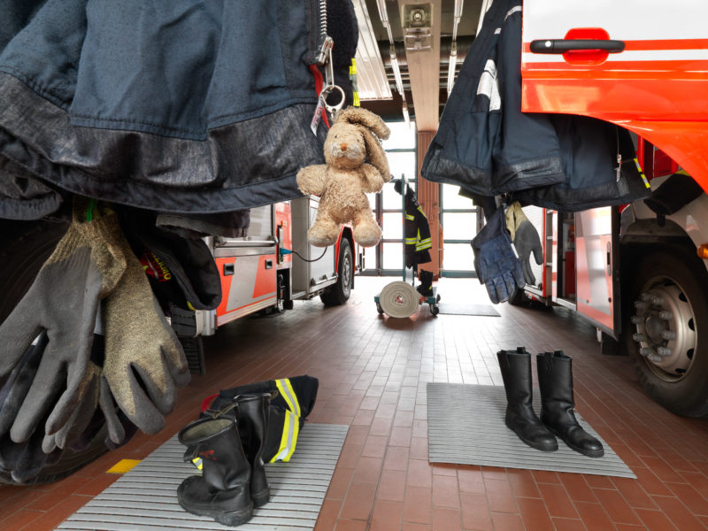 editorial photography: In the garage of a fire station, the firefighter