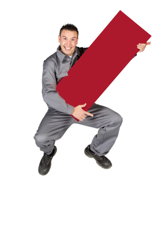 Employees photography: For a personnel campaign of a vehicle manufacturer, employees pose with a red sign against a white background. The photos are full body shots and each person acts differently in front of the camera. Here an employee in work clothes jumps into the air.