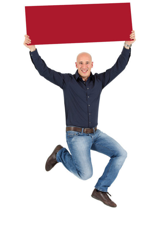 Employees photography: For a personnel campaign of a vehicle manufacturer, employees pose with a red sign against a white background. The photos are full body shots and each person acts differently in front of the camera. Here a woman just stands there relaxed. Here an employee pulls the sign into the air and jumps up.