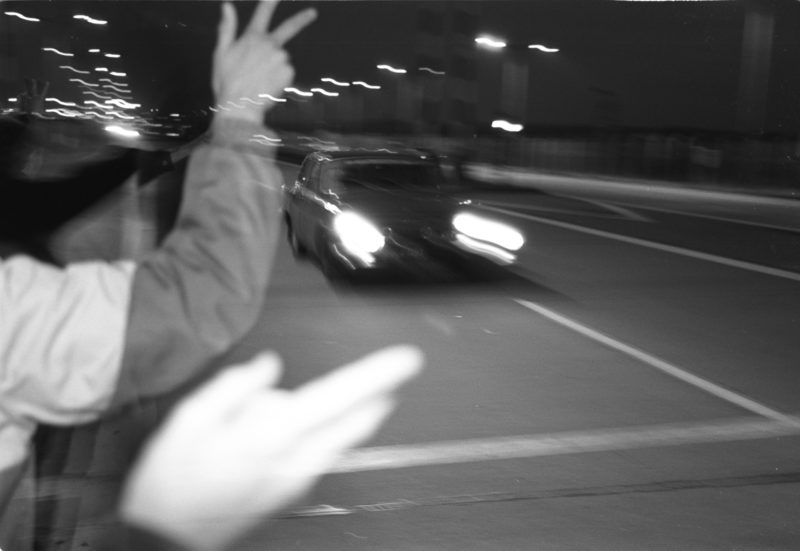 Reportage photographyGDR border opening in 1989: Vehicles from the GDR drive across the open border at the Helmstedt/Marienborn border crossing and are greeted by waving West Germans.Editorial photography: GDR border opening in 1989: Vehicles from the GDR drive across the open border at the Helmstedt/Marienborn border crossing and are greeted by waving West Germans.