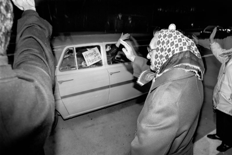 Reportage photographyGDR border opening in 1989: Vehicles from the GDR drive across the open border at the Helmstedt/Marienborn border crossing and are greeted by waving West Germans.Editorial photography: GDR border opening in 1989: Vehicles from the GDR drive across the open border at the Helmstedt/Marienborn border crossing and are greeted by waving West Germans.