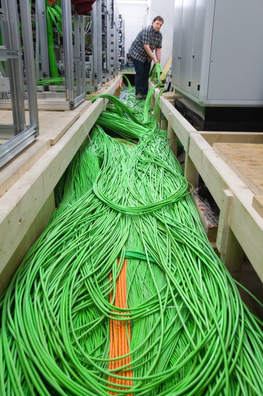 Industrial photography: In a connecting room for a temporary placement switching exchange run hundreds of cables.