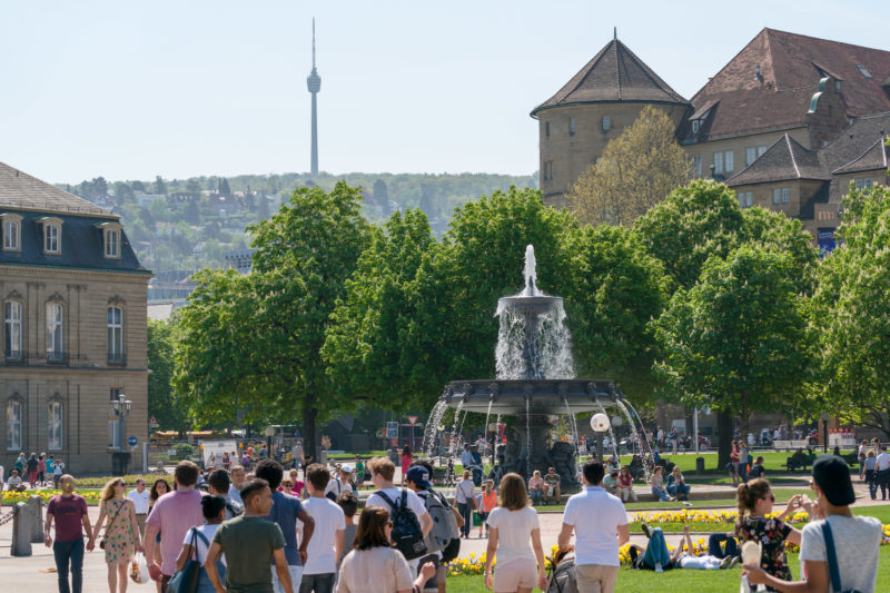 Landscape photography: Summer city view from Stuttgart: View from the Schlossplatz over one of the fountains and the Alter Schl0ß to the television tower in the background.