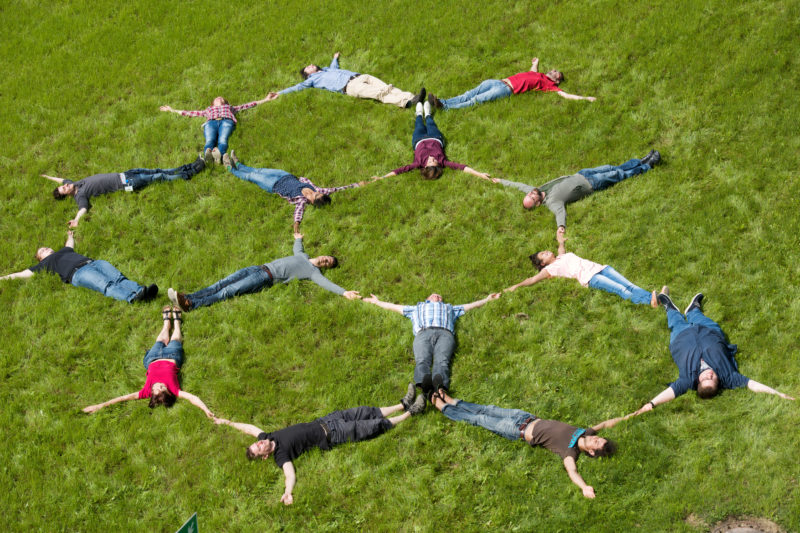 Science photography: On the lawn in front of the Institute the staff of the Department Low-dimensional electron systems of the Max-Planck-Institute for Solid State Research in Stuttgart demonstrate the arrangement of carbon atoms in graphene.