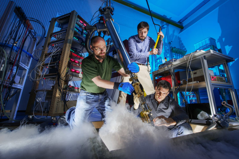 Science photography: Three scientists bring a graphene sample in a cryostat where it is examined at 0.005 degrees above absolute zero temperature for their electrical properties.