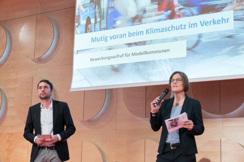 Press photos for an initiative of the Baden-Württemberg state government on the occasion of the kick-off event of the competence network CLIMATE MOBILE with Transport Minister Winfried Hermann: Several people on stage offer varied perspectives.