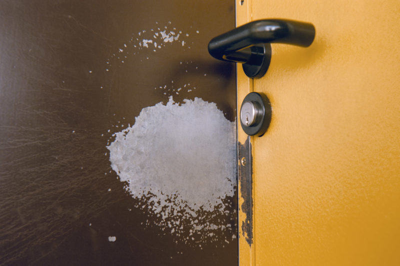 editorial photography at a psychiatric ward: The entrance door to a closed station shows clear traces of the keys due to the constant unlocking and locking.