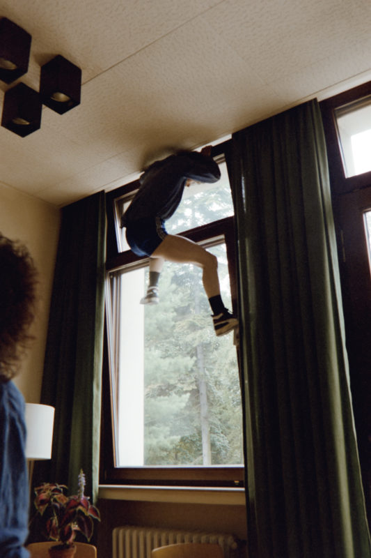 editorial photography at a psychiatric ward: This patient has often escaped from the closed ward through the slanted window in her room.