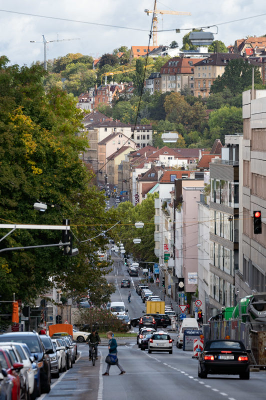 City portrait Stuttgart: View along the Olgastraße towards Wilhelmstraße and Neue Weinsteige with the court district behind. The photo was taken with a long telephoto lens which shortens the distances optically.