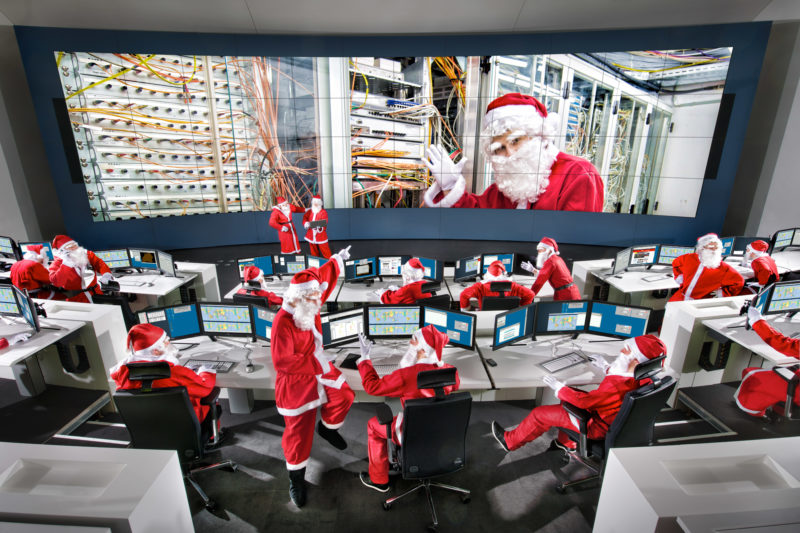 Photo montage: Santas in their control center.